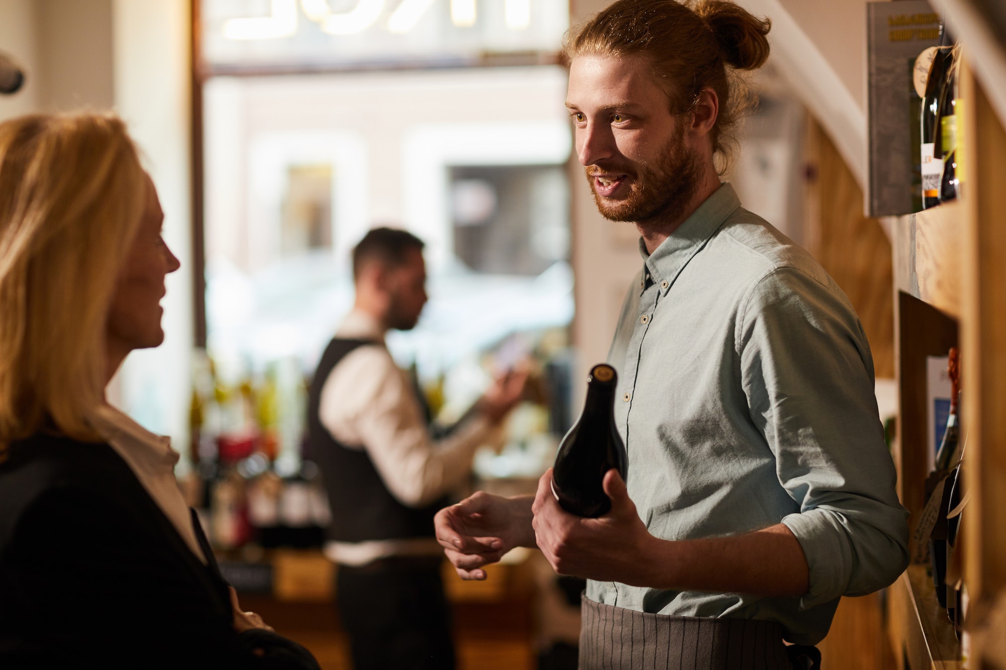 man working in liquor store - Home Based Business Loans