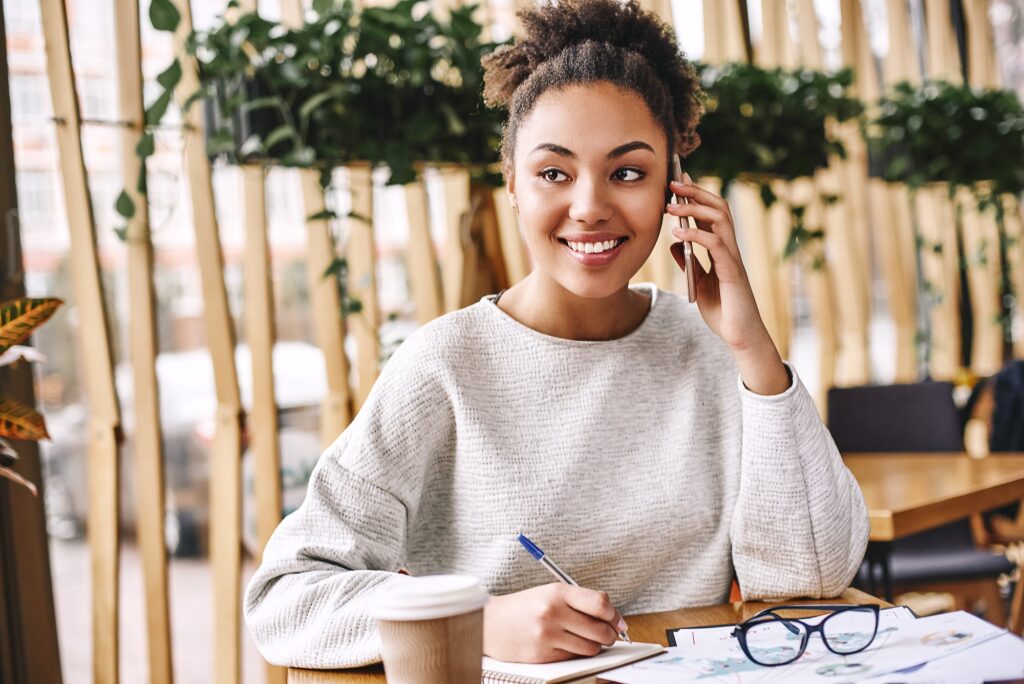 Wonder what your customer really wants Ask. Don t tell. Attractive business woman working at desk in