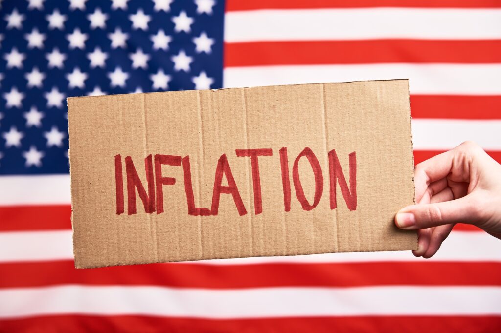 World inflation concept. Woman hold sheet with word inflation