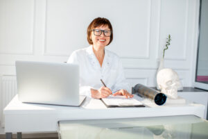 senior woman doctor in the office 300x200 - The Best Finance Podcasts to Help Your Small Business