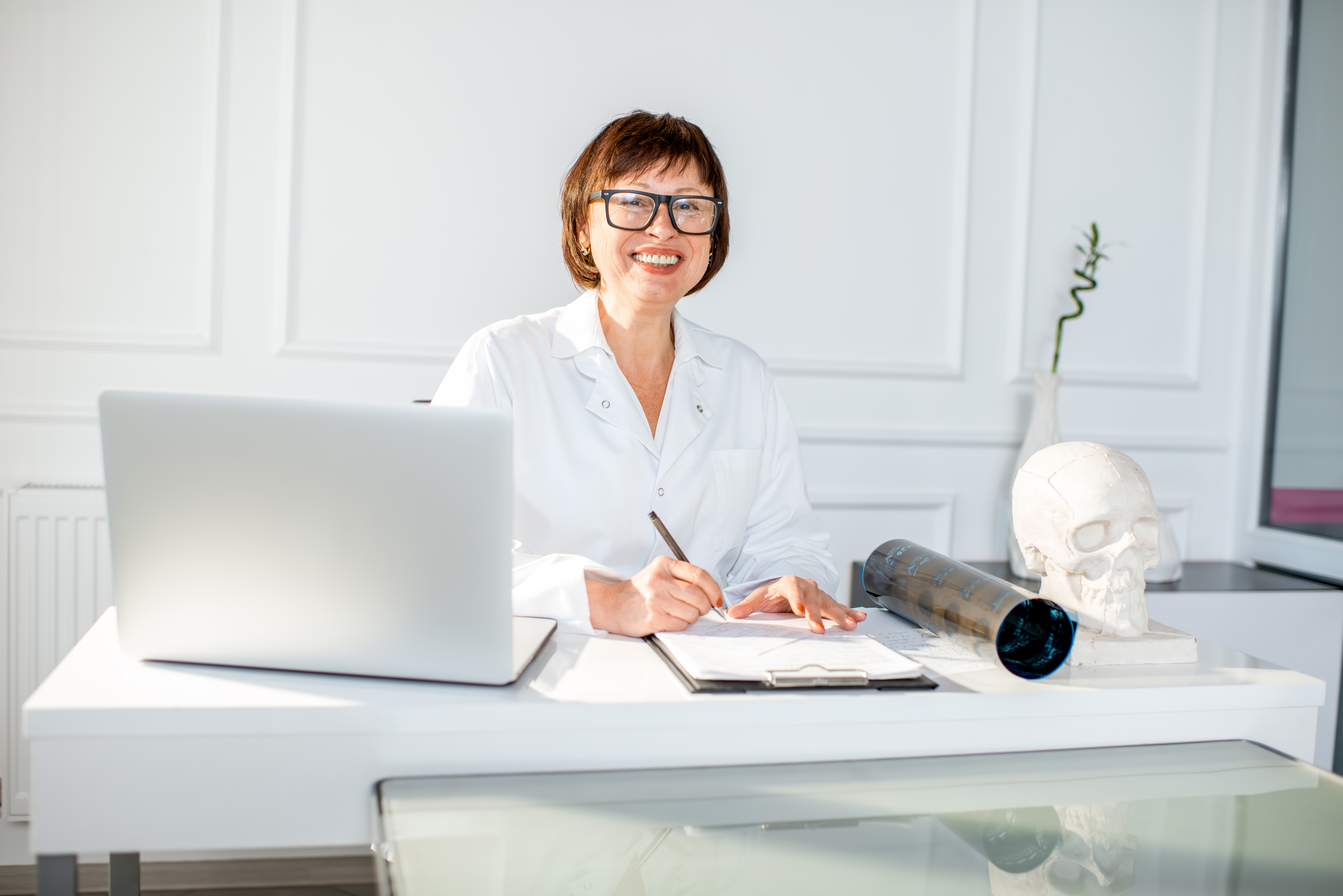senior woman doctor in the office - Home Based Business Loans
