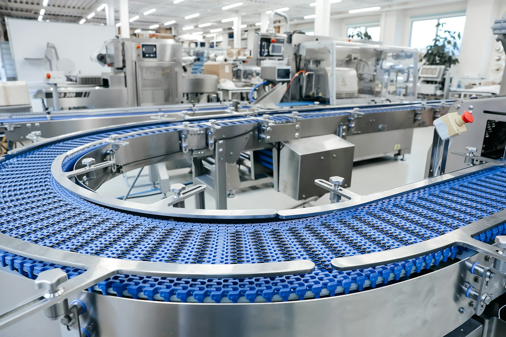 empty modern conveyor belt of production line part of industrial equipment in factory plant - Retail Business Loans
